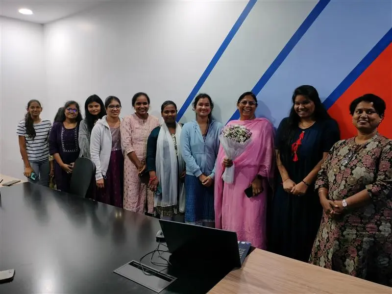 Group of women employees in infoswift formal attire.